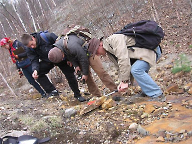 Students examine uranium-rich rocks.